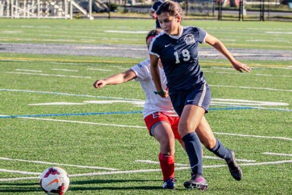 Female playing soccer.