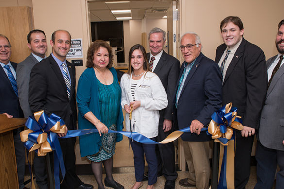 People attending a ribbon cutting ceremony at SJC.