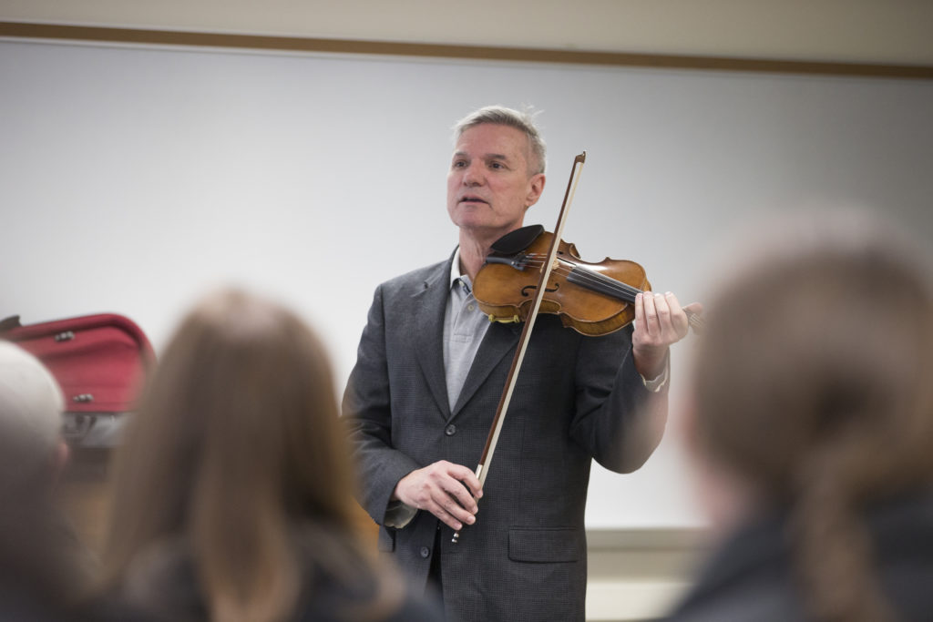 SJC President Boomgaarden playing the violin. 