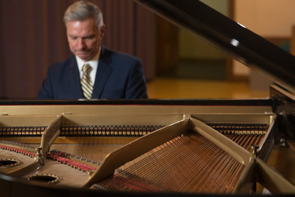 SJC President Boomgaarden playing the piano at SJC Brooklyn.