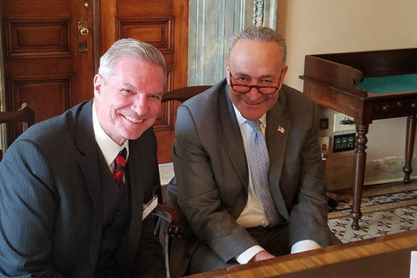 SJC President Donald Boomgaarden sits with U.S. Sen. Chuck Schumer (D-N.Y.).