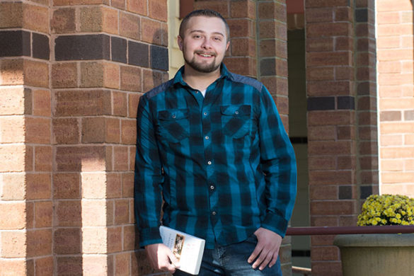 Nicholas Bates in front of the Callahan Library