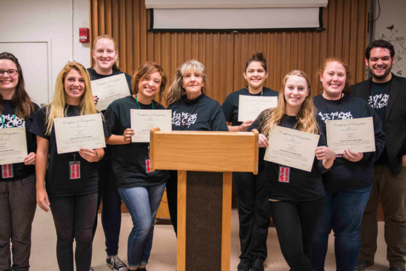 SJC students in the Voices from the Inside course alongside the faculty who led the course.