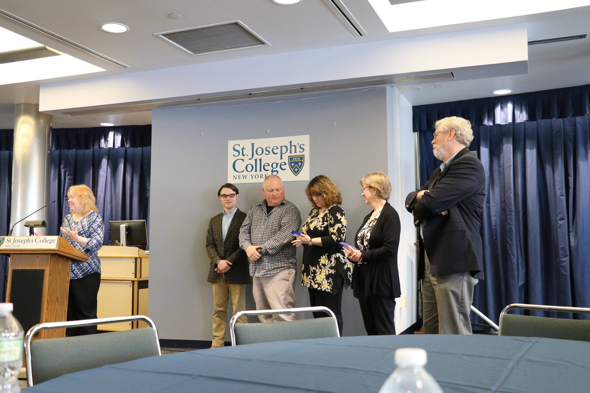 Pat Tracy's family accepting the award in his honor. 