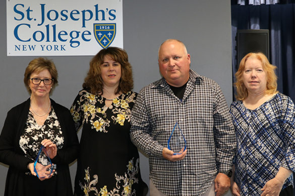 Pat Tracy's family accepting the award in his honor.