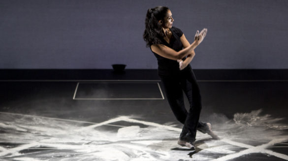 Woman dancing on chalk on stage.