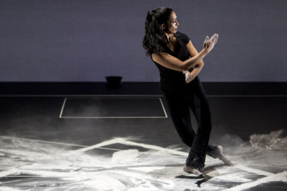 Woman dancing on chalk on stage.