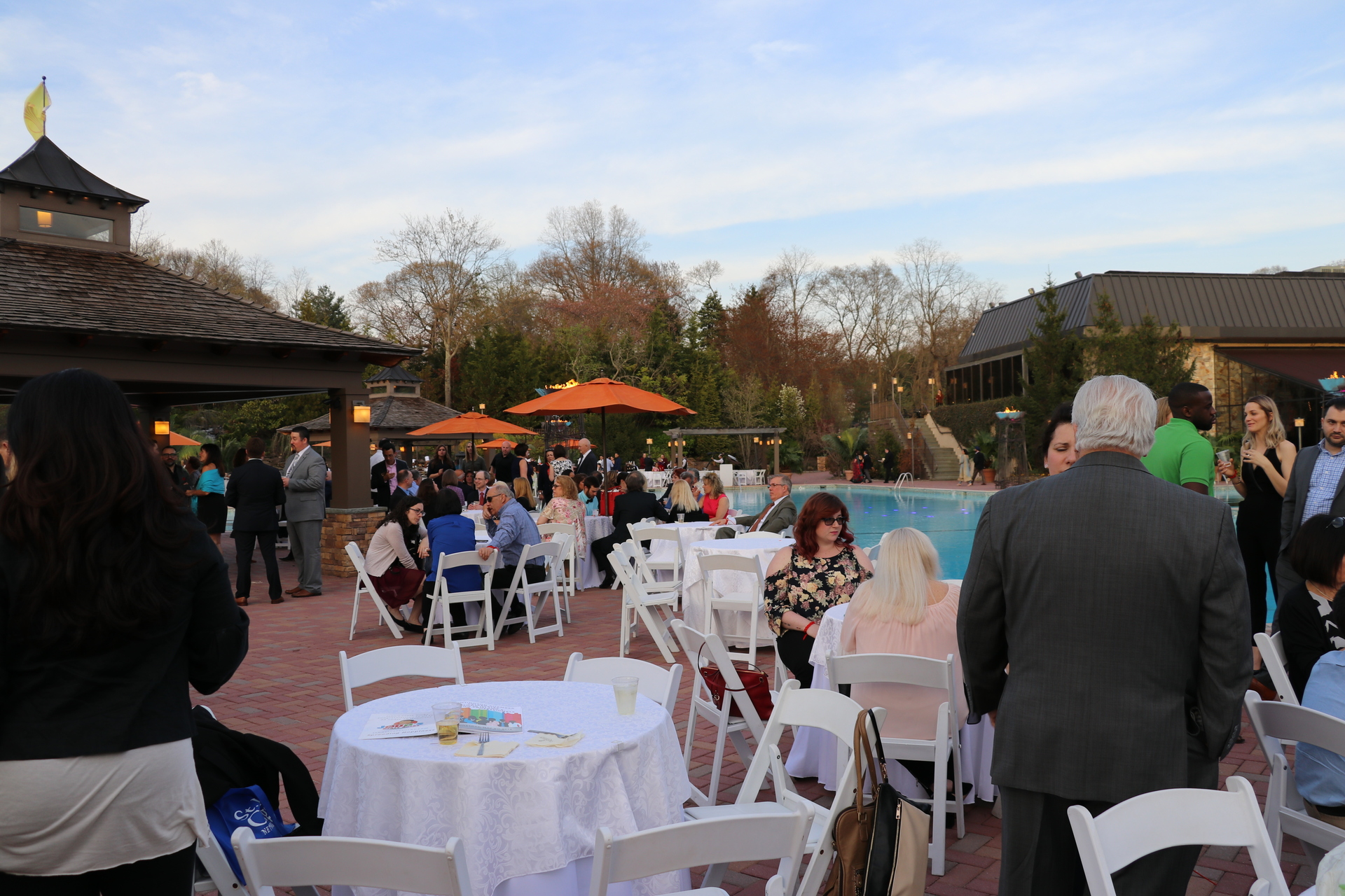 People mingling during the event at Crest Hollow Country Club.