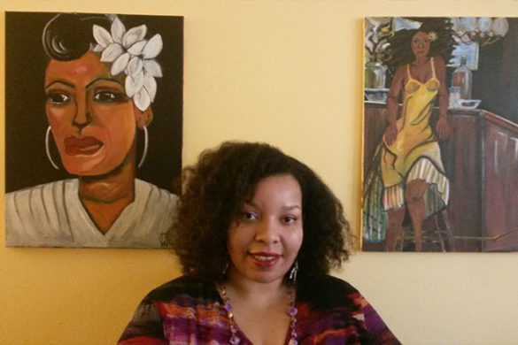 Qiana Watson ’01 in front of her artwork.