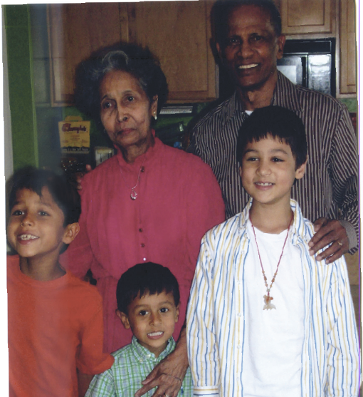 Mr. and Mrs. Outar with their grandsons.