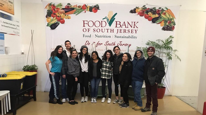 SJC students and staff helping out at a food bank in Camden, NJ.