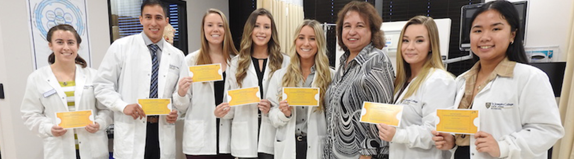 SJC Long Island students holding their golden ticket to Northwell Health's prestigious event.
