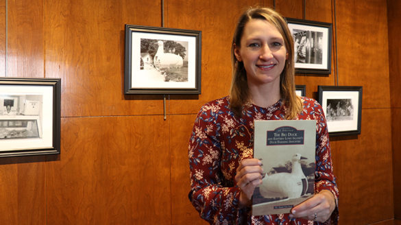 Susan Van Scoy, Ph.D., holding a copy of her new book.