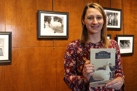 Susan Van Scoy, Ph.D., holding a copy of her new book.