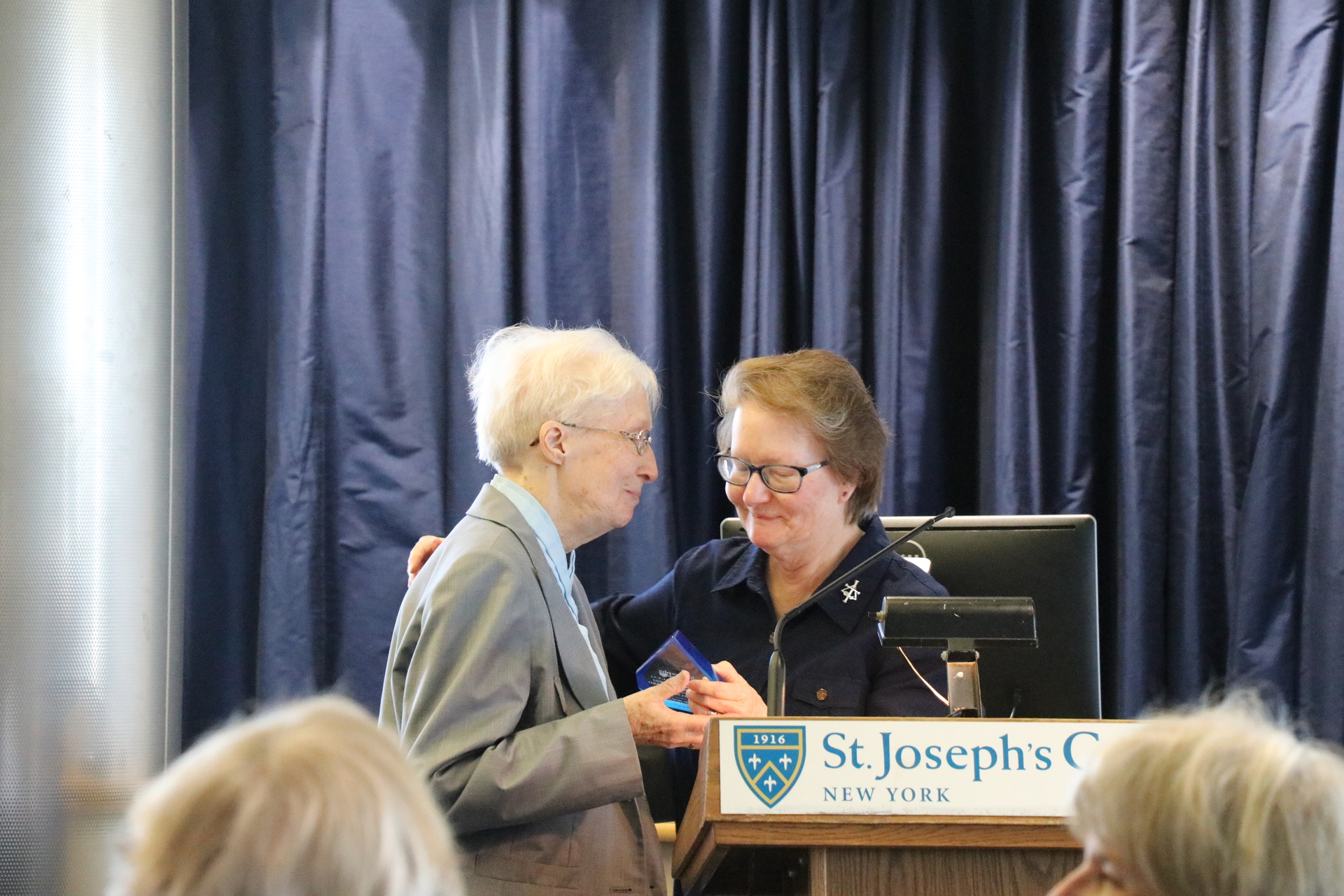 S. Suzanne presenting S. Margaret with the award.