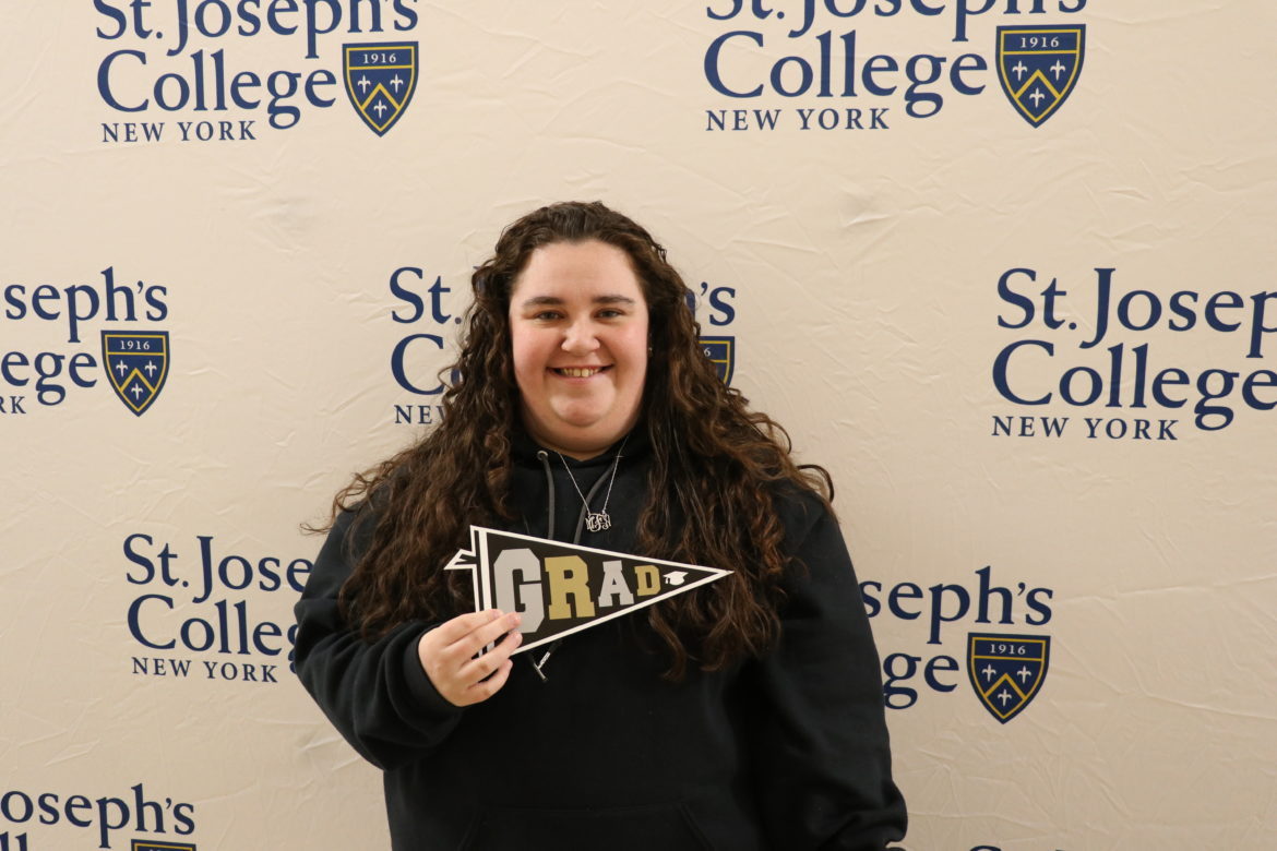 SJC Long Island senior at Cap and Gown Pickup in 2019.