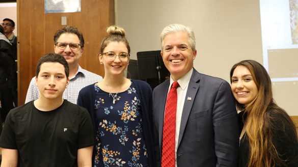 County Executive Steve Bellone with SJC Long Island faculty and students.