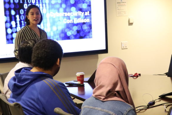 Instructor talking with students.