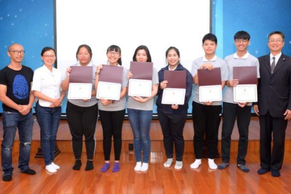 A group of students standing on stage.