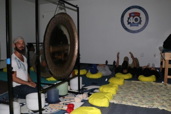 Man seated in sound room.