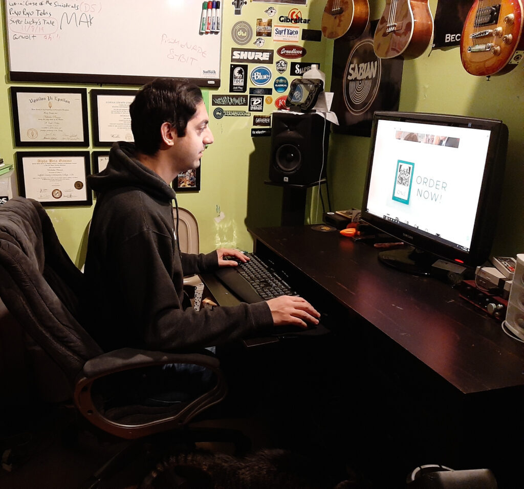 Pinzon working on the ACSSJ website from his office at home.