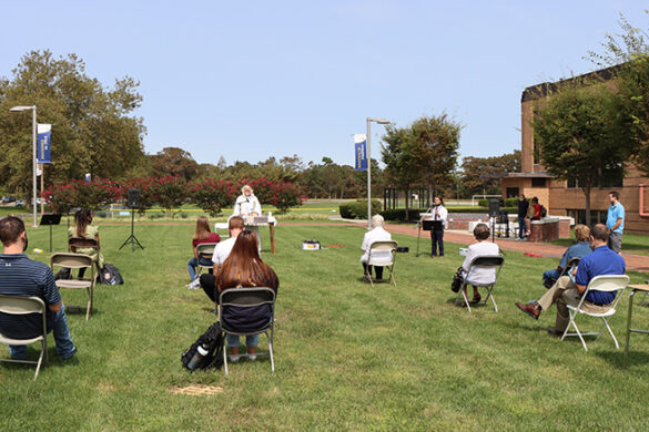 Students, faculty and staff at Mass on the Grass.