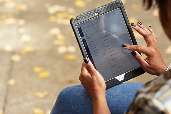 student taking an online course on a tablet, were no textbooks are required.