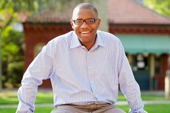 Man sitting and smiling.