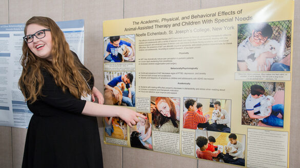 Student presenting her research at the College's annual symposium.