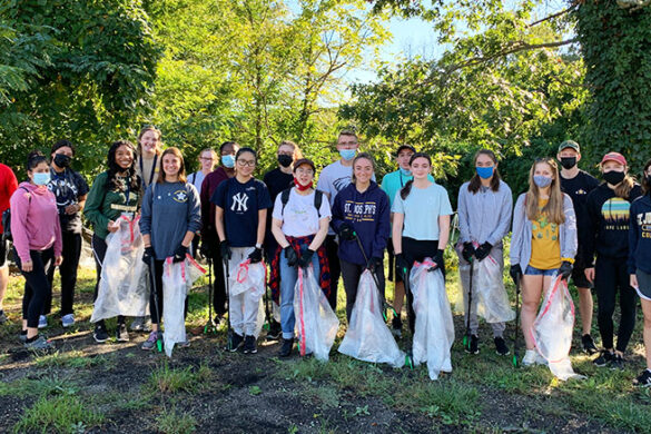 SJC community participating in the Patchogue River Clean Up.