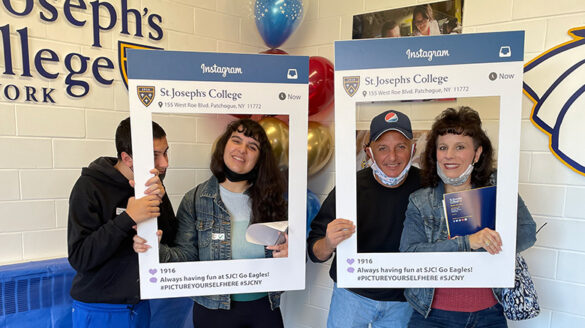 A prospective student and her family at the SJC Long Island Open House.