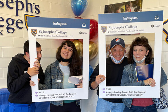 A prospective student and her family at the SJC Long Island Open House.