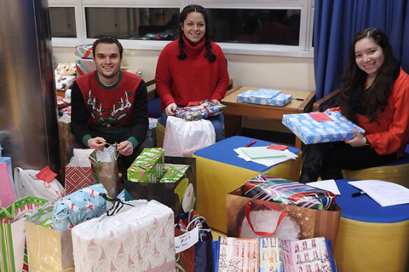 Christmas Gift Drive presents being wrapped, 2018.