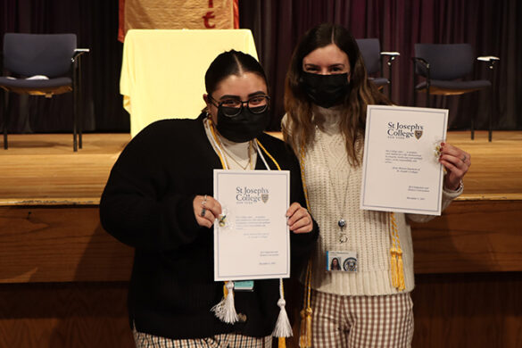 Honors Convocation at SJC Long Island, where two students pose with their pins and cords.