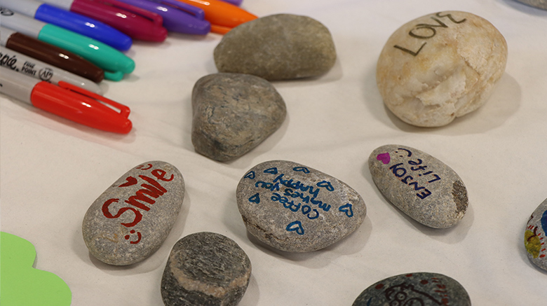 Rocks with handwritten notes on them.