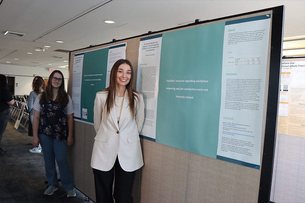 Students with their posters at the Student Research Symposium.