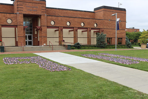 9/11 written out on the Long Island Campus quad using American flags.