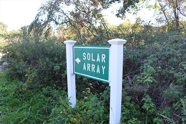 Sign to the solar array, which is in a gated-off area.