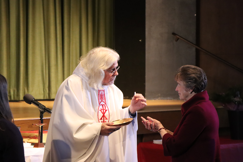 S. Mary Ann Cashin receiving communion at the St. Joseph's Day Celebration.