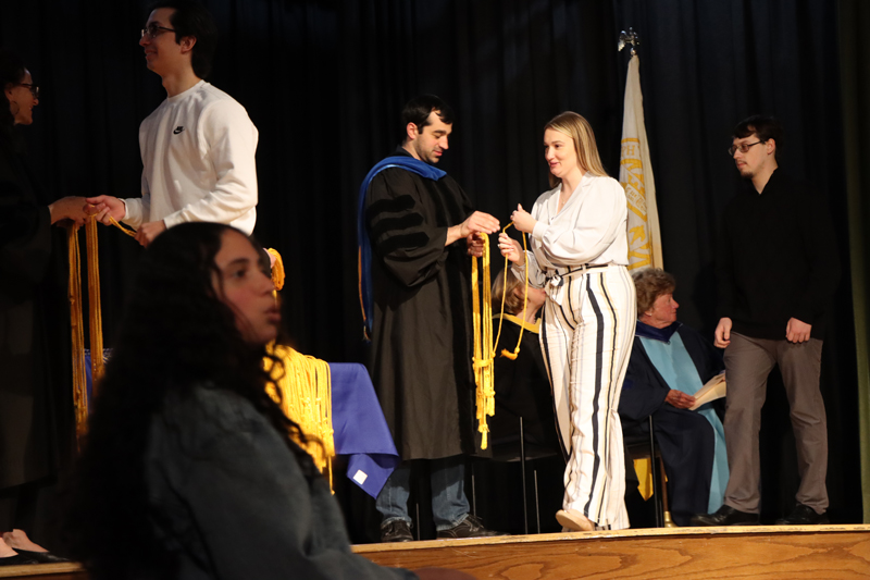 Students receiving their cords at the Long Island Honors Convocation.