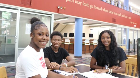 Students seated in library.