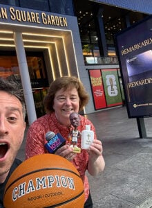 S. Marie Mackey and Johnny Mignione standing in front of Madison Square Garden. 