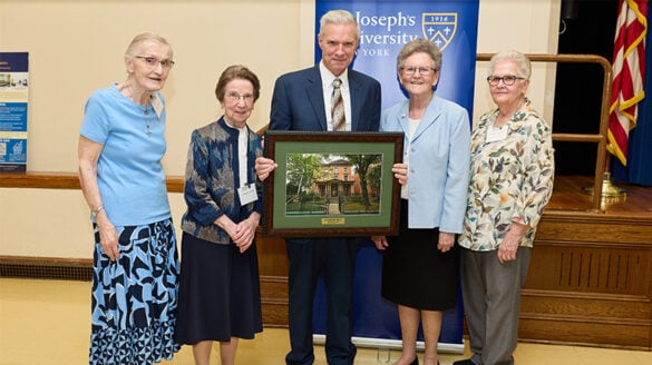 SJNY President Donald R. Boomgaarden taking a picture with the Sisters of St. Joseph