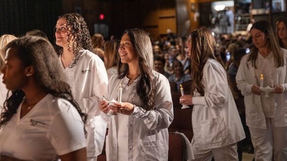 nursing_Li3 Students smiling while holding their candles