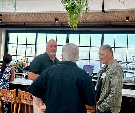 Guest conversing with one another at the bar